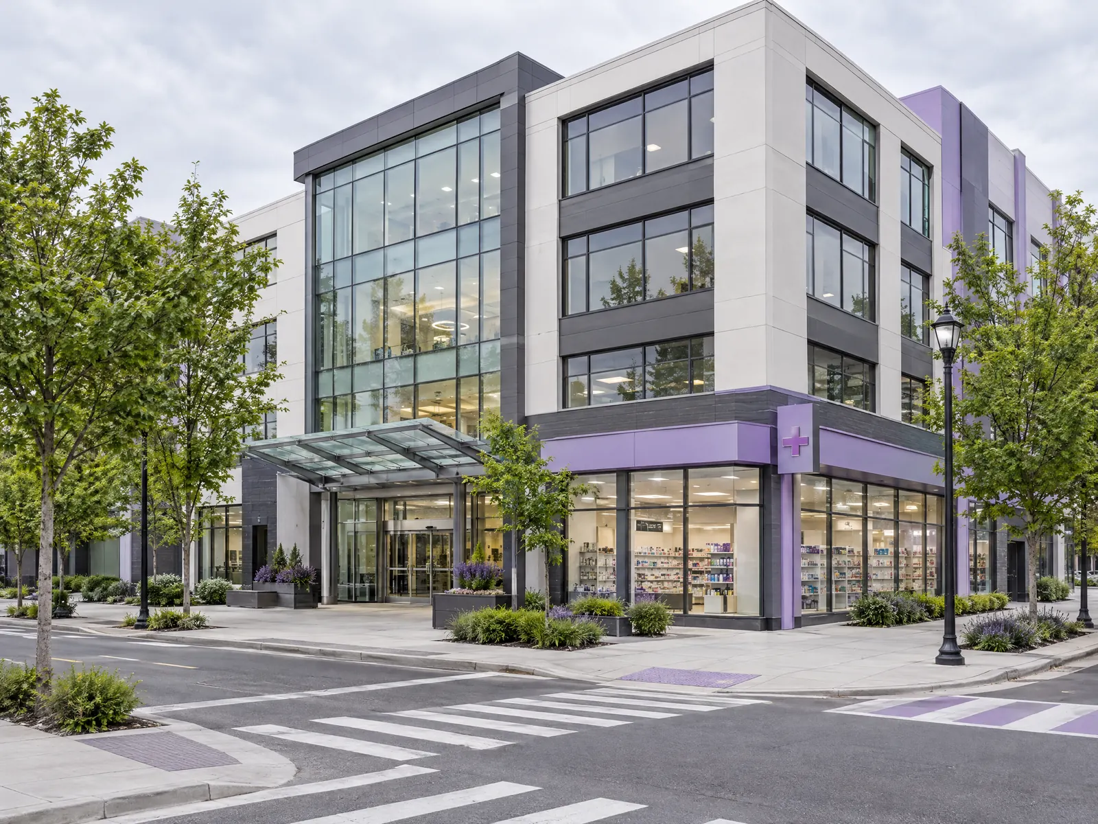 Modern medical office building with a glass entrance and corner pharmacy at a crosswalk